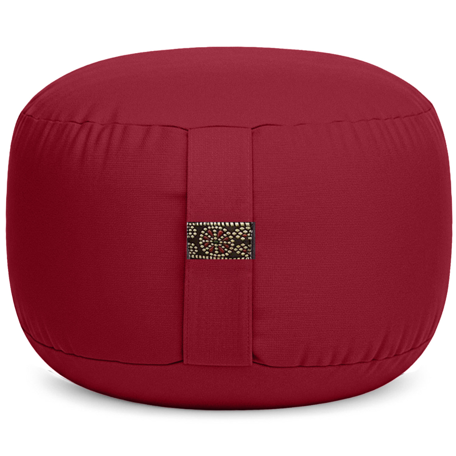 Ein rotes Meditationskissen mit einem dekorativen Musterstreifen an der Seite.