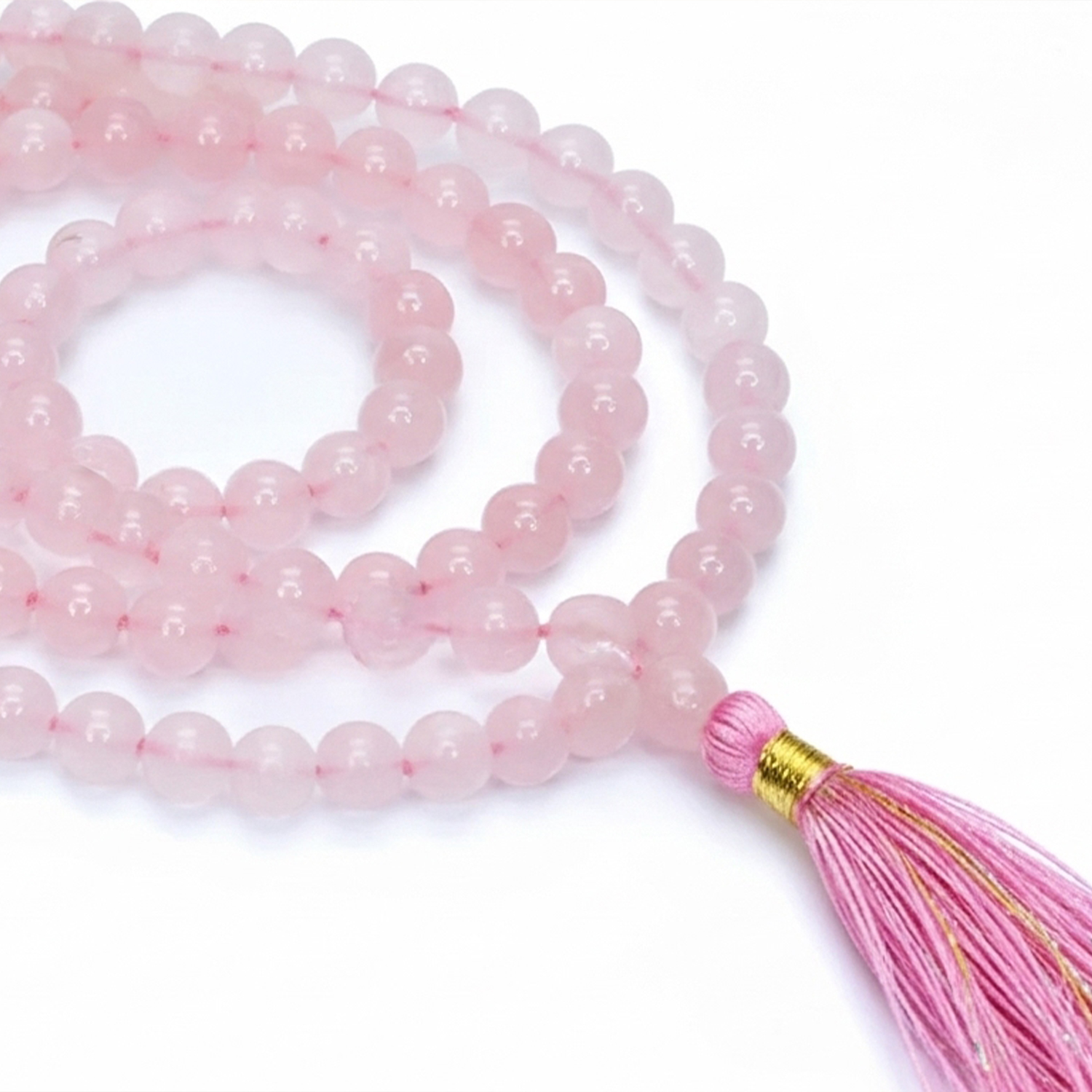 Rosa Perlenkette aus runden Steinen mit pinker Quaste