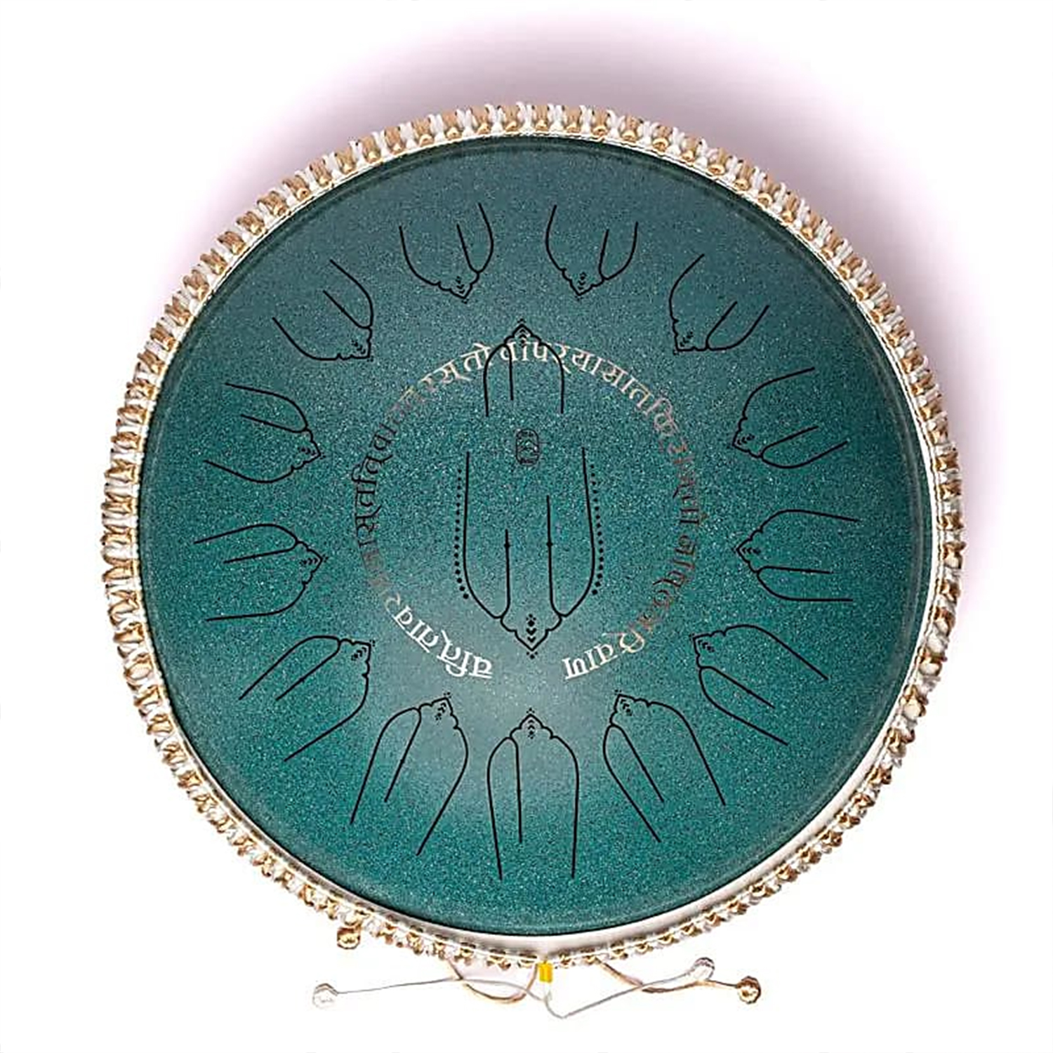 Runde grüne Zungentrommel aus Metall mit eingravierten Mustern und umlaufender Verzierung