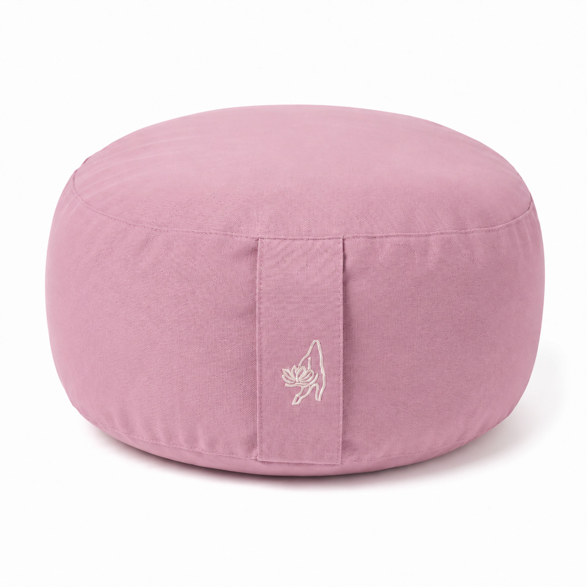 Rundes rosa Meditationskissen aus Stoff vor hellem Hintergrund